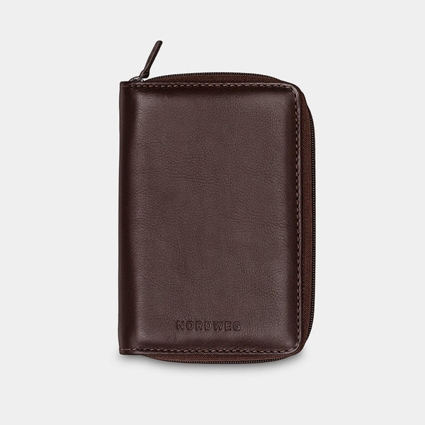 Nordweg Nomad leather passport wallet in coffee, front view with zip-around closure