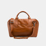 Nordweg Nomad leather weekender duffel bag in caramel, front view with handles and shoulder strap