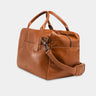 Nordweg Nomad leather weekender duffel bag in caramel, side view with shoulder strap