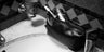 Black Nomad leather dopp kit on a bathroom counter with toiletries