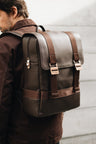 Coffee Nordweg Dolomites leather travel backpack worn over one shoulder outdoors, SKU NW101.IC