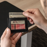 Nordweg NW109 Flint leather cardholder wallet in Black, ID window with red plaid lining, SKU NW109.IP, GTIN 7898571001235