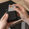 Nordweg NW109 Flint leather cardholder wallet in Black with payment card being inserted, SKU NW109.IP, GTIN 7898571001235
