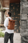 Cognac Nordweg Legacy leather backpack worn outdoors in the city, SKU NWL001.CG