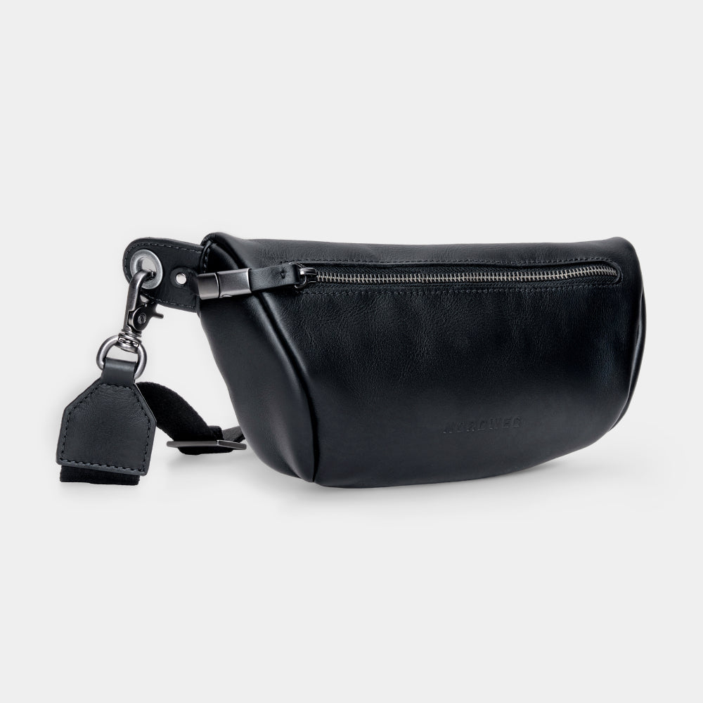 Pulse leather sling bag in black, angled front view