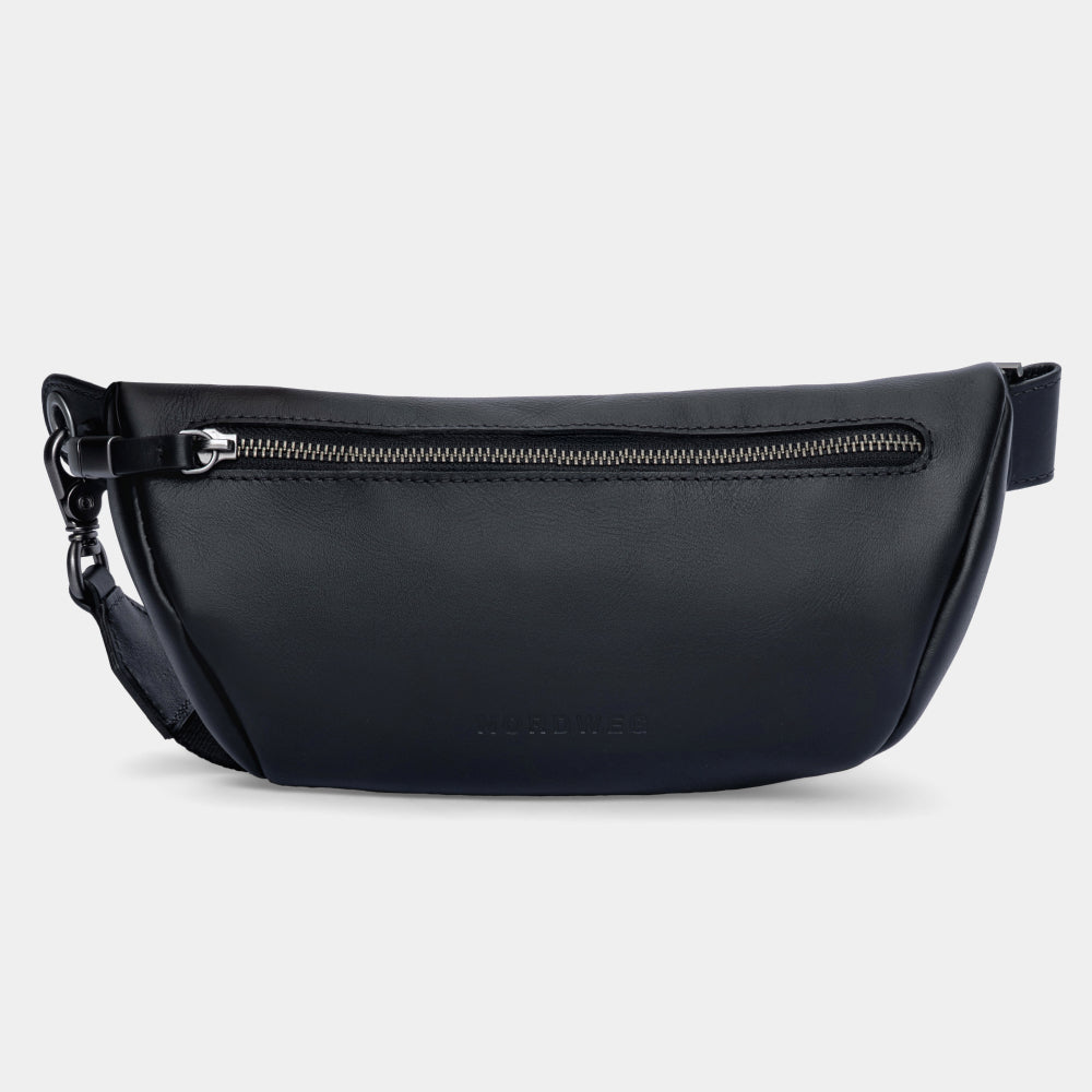 Nordweg Pulse leather sling crossbody bag in black, front view with zip pocket