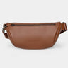 Nordweg Pulse leather sling crossbody bag in caramel, front view with zip pocket