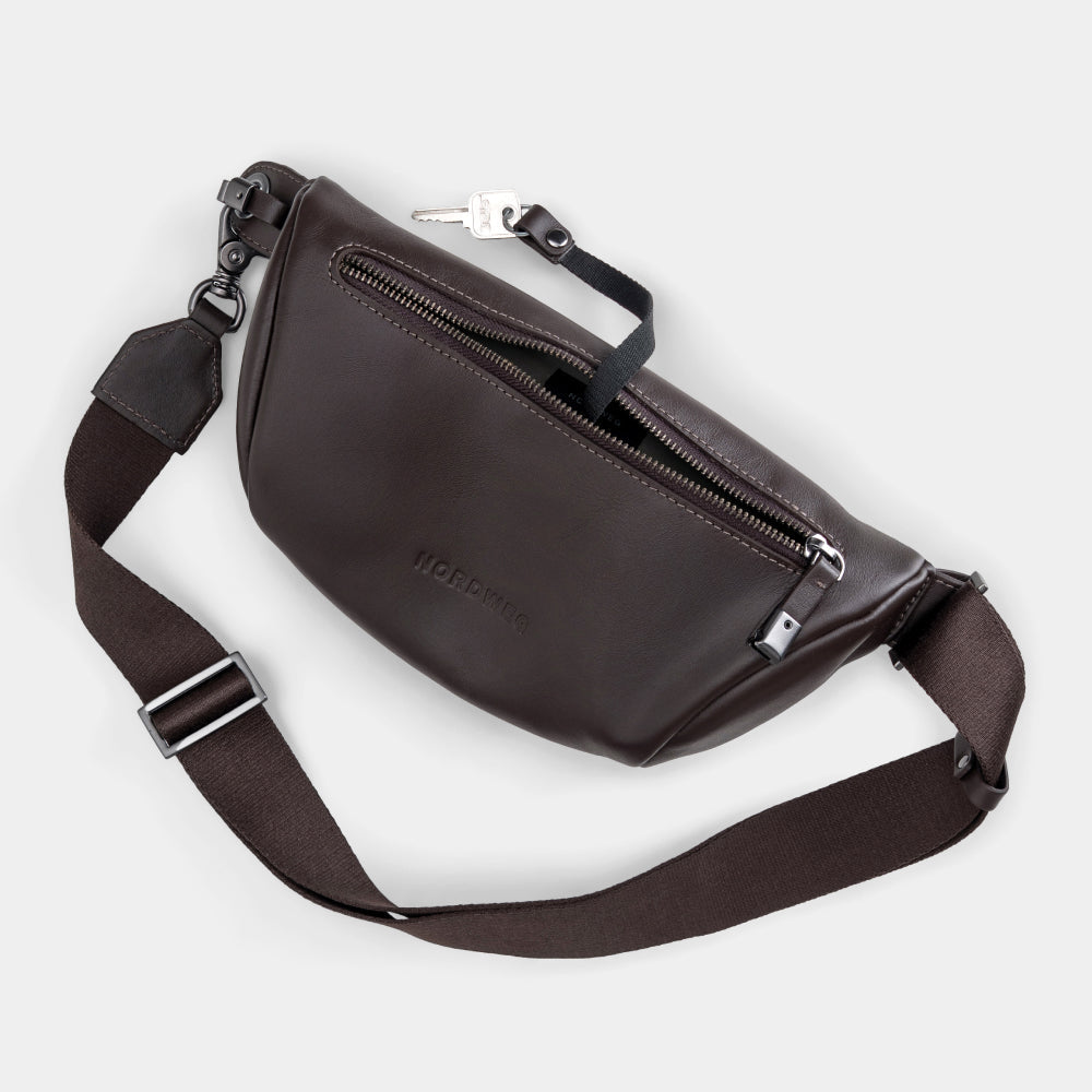 Coffee Pulse leather sling bag angled back view with strap and key detail