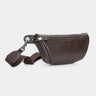 Nordweg Pulse leather sling crossbody bag in coffee, angled front view with strap and key tag