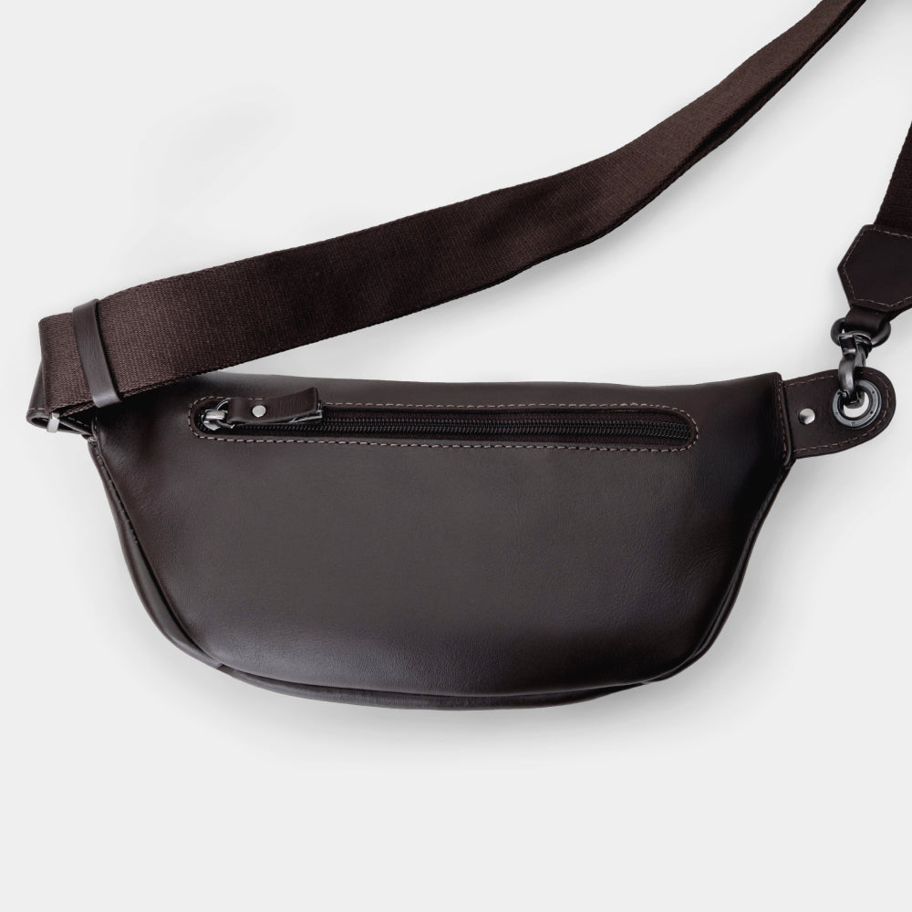 Nordweg Pulse leather sling crossbody bag in coffee, back view with adjustable strap and rear zip pocket