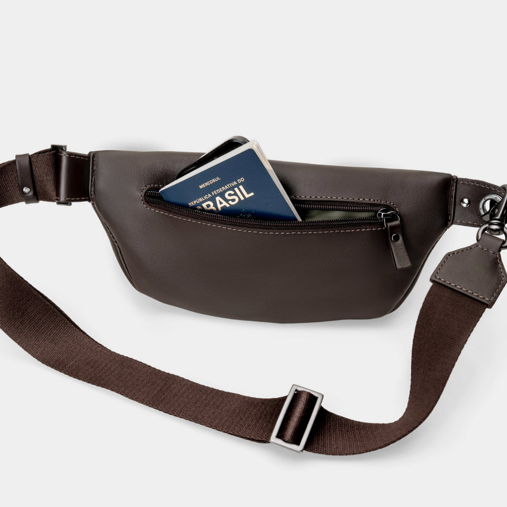 Coffee Pulse leather sling crossbody bag with rear pocket shown holding a card