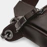 Close-up of coffee Pulse leather sling bag zipper lock and hardware detail