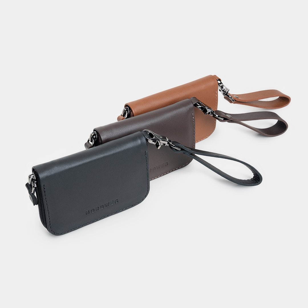 Traveler Pro AirTag leather wallets in black, coffee, and caramel color lineup