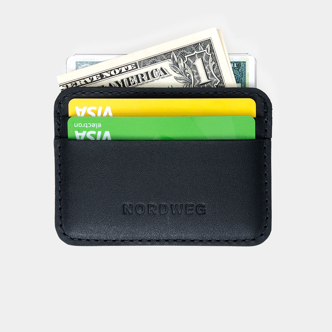 Black Traveler Pro AirTag wallet mini cardholder holding cards and cash