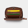 Open caramel Traveler Pro AirTag leather wallet, front view of card slots and interior pockets