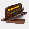 Angled open view of the Nordweg Traveler Pro Wallet in Caramel with cards, cash, and wrist strap visible.
