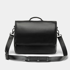 Nordweg Workday leather briefcase laptop work bag in black, front view with flap and shoulder strap