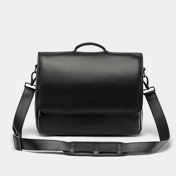 Nordweg Workday leather briefcase laptop work bag in black, front view with flap and shoulder strap