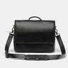 Nordweg Workday leather briefcase laptop work bag in black, front view with flap and shoulder strap