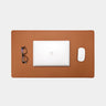 Nordweg Workplace leather desk pad in caramel with laptop, mouse, and glasses