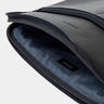 Open black Workplace leather laptop sleeve case showing padded gray lining
