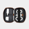 Open caramel Nordweg Workplace leather tech organizer with cables, charger, and earbuds case