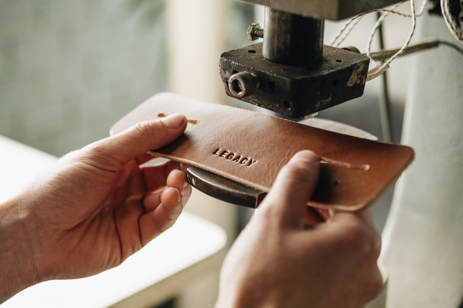 Vegetable-tanned soleta leather being pressed in the workshop