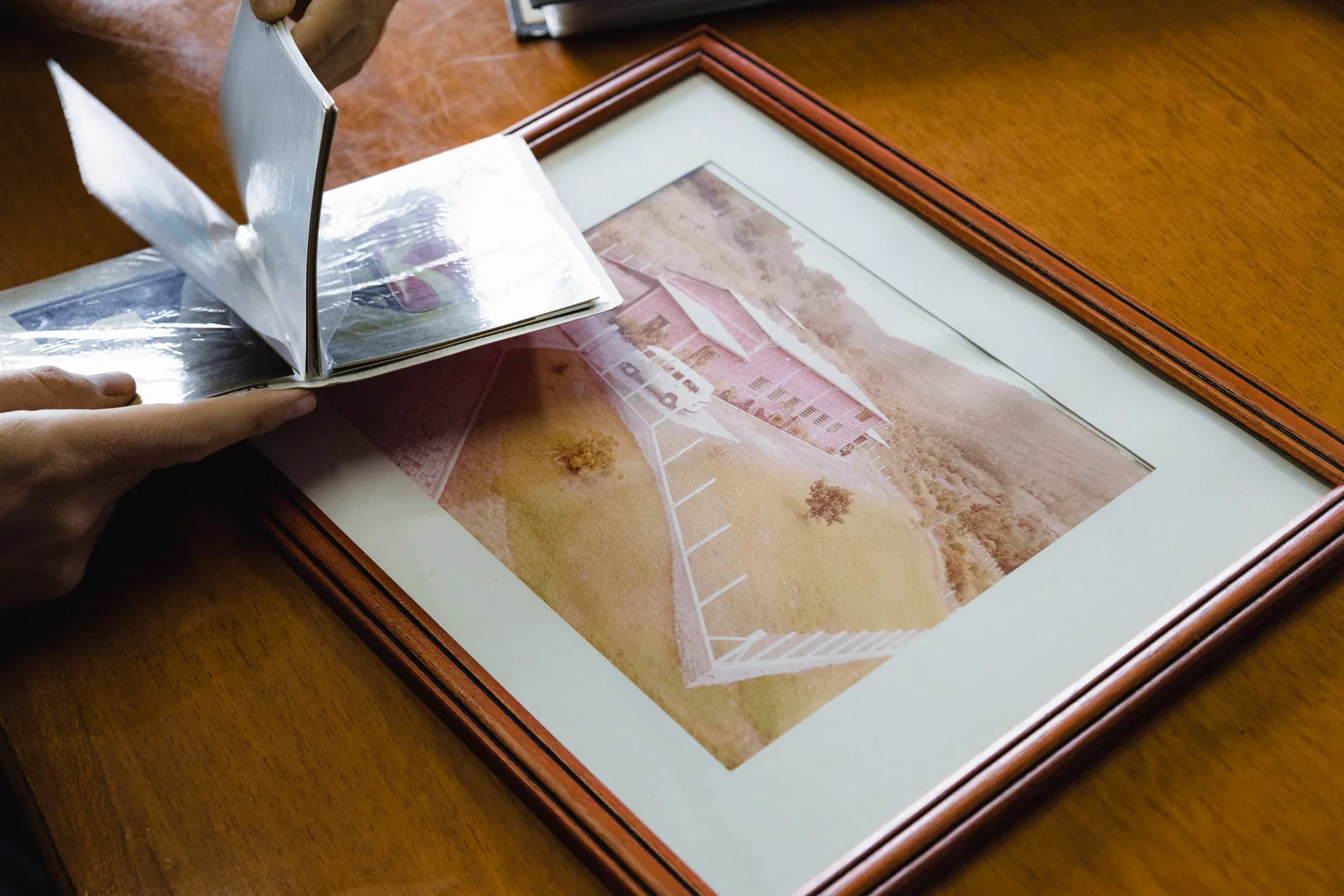 A framed photograph of the family factory when it was first built