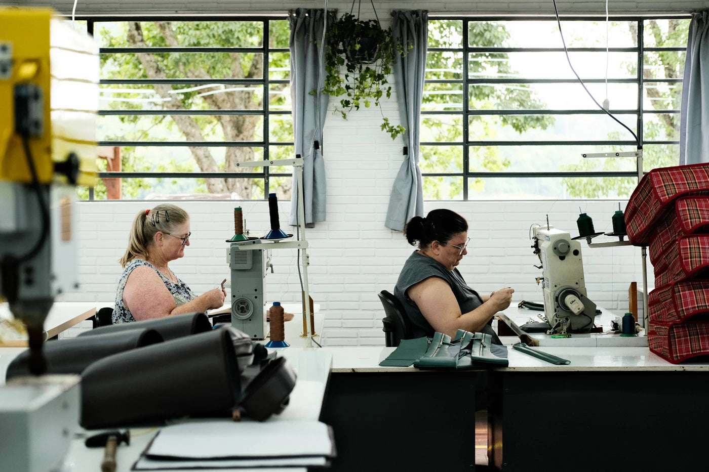 Nordweg makers working at sewing machines in the workshop