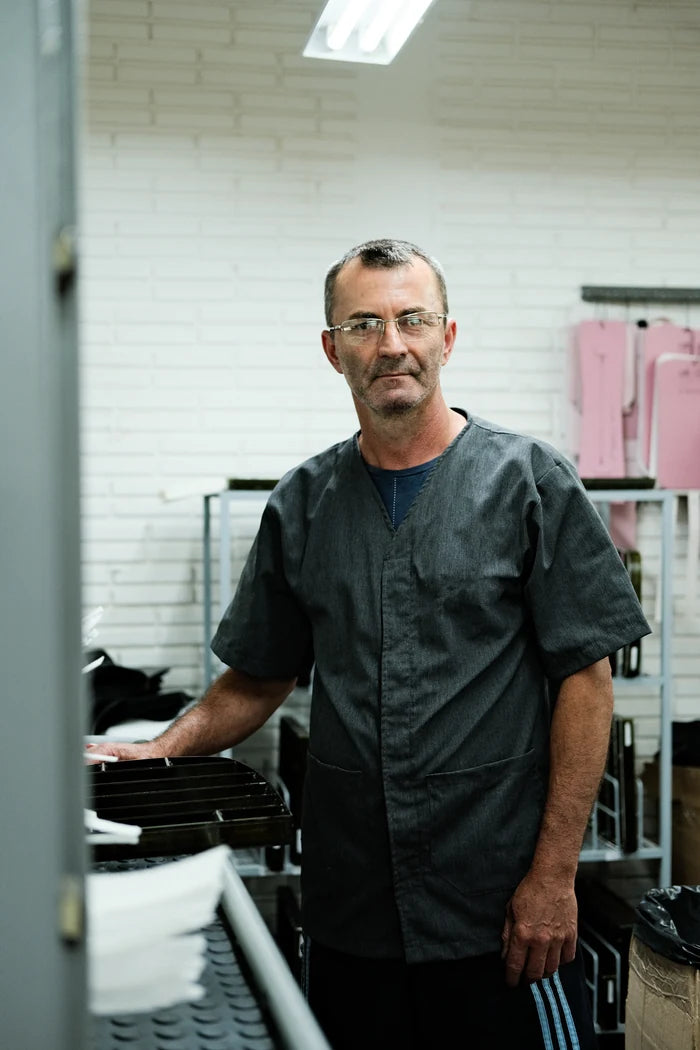 A member of the Nordweg team beside the workshop equipment