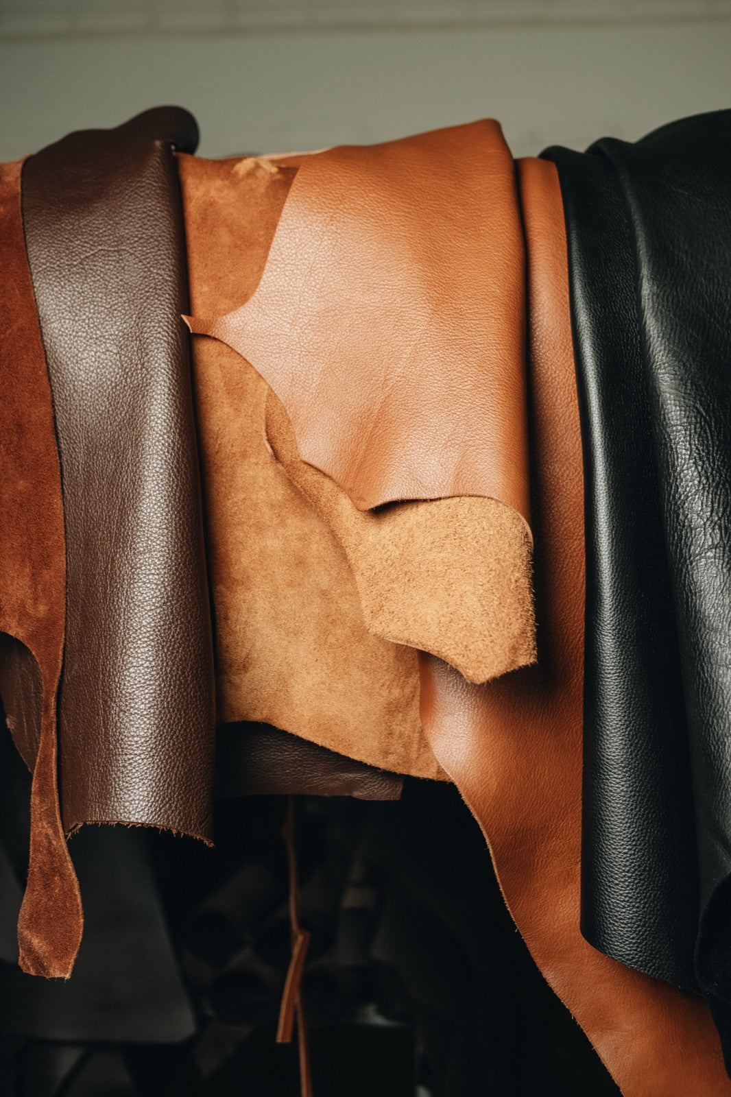 Caramel, natural and black leather hides in the Nordweg workshop