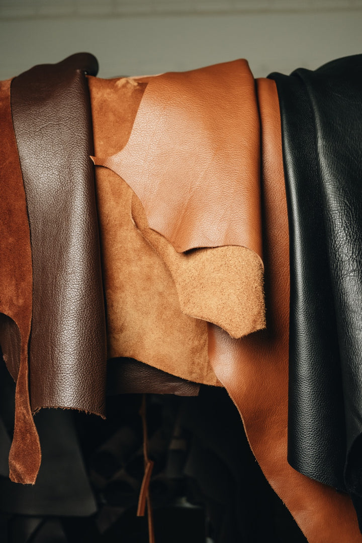 Caramel, natural and black leather hides in the Nordweg workshop