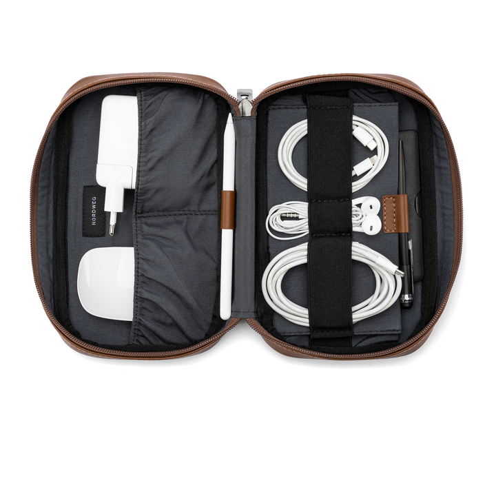 Workplace leather tech organizer open with black interior, brown trim, and organized cables